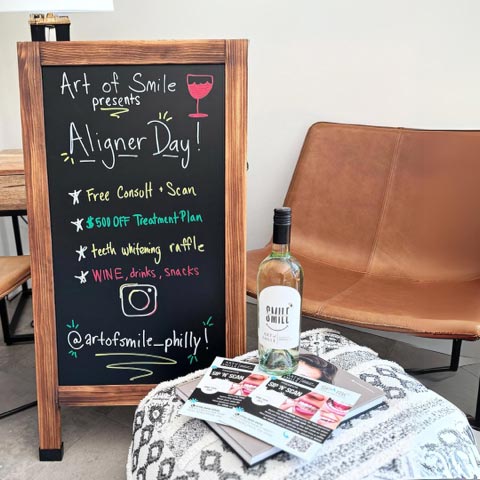 Aligner Day - A cozy café interior with oversized colorful paper flowers decorating the space, creating a vibrant and inviting atmosphere